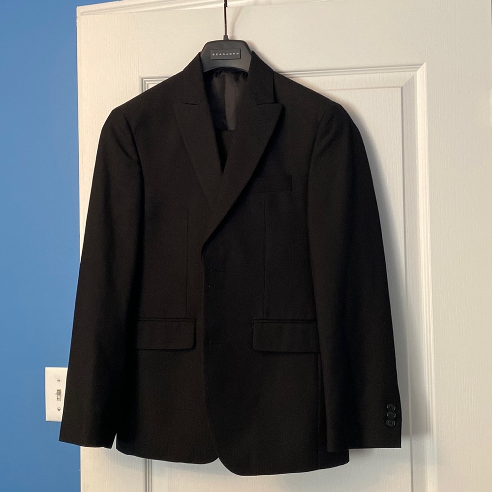 Boys black suit worn for graduation. Size 34S . Straight pants with no pleats.